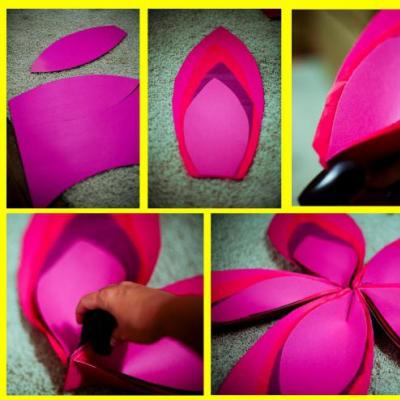 Do-it-yourself voluminous paper flowers on the wall to decorate the room using templates